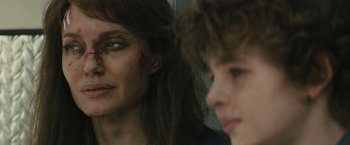 Movie still from “Wrong Turn” (2021), directed by Mike P. Nelson – A woman and a young boy are looking into the distance; Close Up shot, Over the shoulder angle