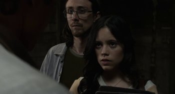 Movie still from “X” (2022), directed by Ti West – A man and a woman looking at a laptop; Close Up shot, Over the shoulder angle