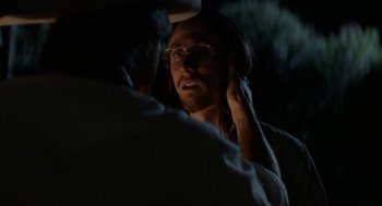 Movie still from “X” (2022), directed by Ti West – A man with long hair is looking at another man with long hair; Close Up shot, Over the shoulder angle