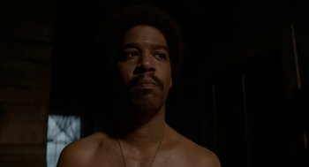 Movie still from “X” (2022), directed by Ti West – A person wearing a necklace; Close Up shot, Low angle