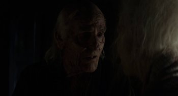 Movie still from “X” (2022), directed by Ti West – An old man is looking into the dark; Close Up shot, Over the shoulder angle