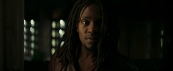 Movie still from “Yardie” (2018), directed by Idris Elba – A person with dreadlocks; Close Up shot, Low angle
