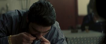 Movie still from “Yardie” (2018), directed by Idris Elba – A young man sitting in front of a mirror; Extreme Close Up shot, High angle