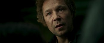 Movie still from “Yardie” (2018), directed by Idris Elba – A person looking at the camera; Close Up shot, Low angle