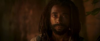 Movie still from “Yardie” (2018), directed by Idris Elba – A person with dreadlocks; Close Up shot, Low angle