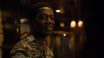 Movie still from “Snowfall” (2017), directed by Hiro Murai – A person smiling at the camera; Close Up shot, Over the shoulder angle