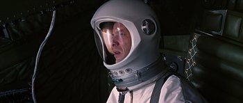 Movie still from “You Only Live Twice” (1967), directed by Lewis Gilbert – A man wearing a space suit and a helmet; Close Up shot, Overhead angle