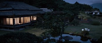 Movie still from “You Only Live Twice” (1967), directed by Lewis Gilbert – A house in the middle of the night with a pond in front of it; Extreme Wide shot, High angle