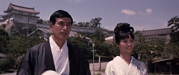 Movie still from “You Only Live Twice” (1967), directed by Lewis Gilbert – A man and a woman dressed in traditional japanese garb; Medium shot, Low angle