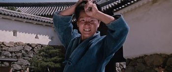 Movie still from “You Only Live Twice” (1967), directed by Lewis Gilbert – A woman in a blue robe holding a knife in her hand; Close Up shot, Low angle