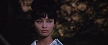 Movie still from “You Only Live Twice” (1967), directed by Lewis Gilbert – A person wearing a dress; Close Up shot, Low angle