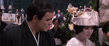Movie still from “You Only Live Twice” (1967), directed by Lewis Gilbert – A man and a woman in traditional japanese garb; Close Up shot, Over the shoulder angle