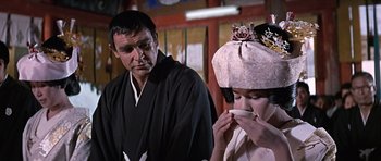 Movie still from “You Only Live Twice” (1967), directed by Lewis Gilbert – A man and a woman in traditional japanese garb; Close Up shot, Over the shoulder angle