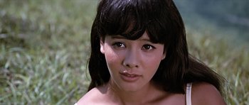 Movie still from “You Only Live Twice” (1967), directed by Lewis Gilbert – A woman's face in the grass; Close Up shot, Low angle