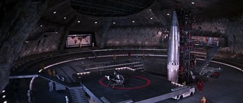 Movie still from “You Only Live Twice” (1967), directed by Lewis Gilbert – An empty wrestling ring in a large arena; Extreme Wide shot, High angle