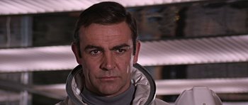 Movie still from “You Only Live Twice” (1967), directed by Lewis Gilbert – A person wearing a space suit; Close Up shot, Low angle