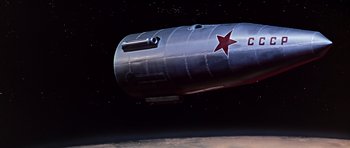 Movie still from “You Only Live Twice” (1967), directed by Lewis Gilbert – An image of an airplane in the sky; Extreme Wide shot, Low angle