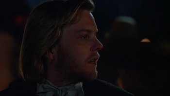 Movie still from “Young Guns” (1988), directed by Christopher Cain – A person with long hair; Close Up shot, Over the shoulder angle