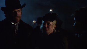 Movie still from “Young Guns” (1988), directed by Christopher Cain – A man and a woman in a black hat; Close Up shot, Low angle