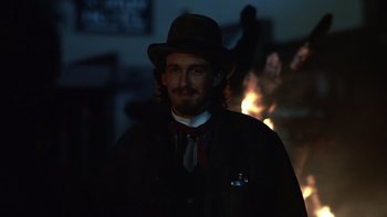 Movie still from “Young Guns” (1988), directed by Christopher Cain – A man wearing a hat and a jacket; Close Up shot, Low angle