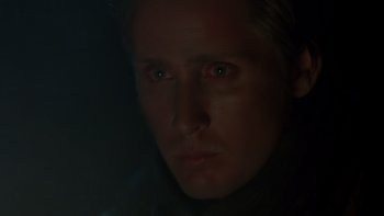 Movie still from “Young Guns” (1988), directed by Christopher Cain – A person's face in the dark; Close Up shot, Low angle