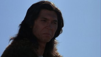 Movie still from “Young Guns” (1988), directed by Christopher Cain – A person with long black hair; Close Up shot, Low angle