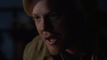 Movie still from “Young Guns” (1988), directed by Christopher Cain – A person with a beard; Close Up shot, Over the shoulder angle