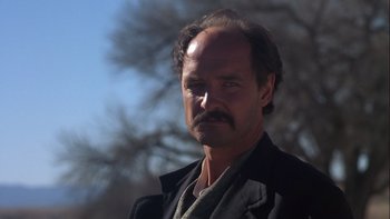 Movie still from “Young Guns” (1988), directed by Christopher Cain – A person wearing a jacket; Close Up shot, Low angle