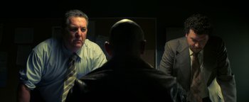 Movie still from “Zeroville” (2019), directed by James Franco – A man sitting in front of two other men in front of a mirror; Medium shot, Over the shoulder angle