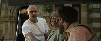 Movie still from “Zeroville” (2019), directed by James Franco – A man and a woman talking to a man in front of a mirror; Close Up shot, Over the shoulder angle
