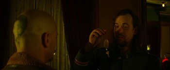 Movie still from “Zeroville” (2019), directed by James Franco – A man holding a spoon in his hand; Close Up shot, Over the shoulder angle