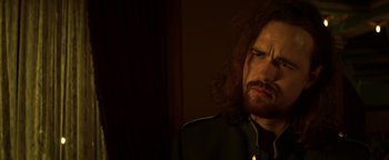 Movie still from “Zeroville” (2019), directed by James Franco – A person with long curly hair; Close Up shot, Low angle
