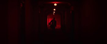 Movie still from “Zeroville” (2019), directed by James Franco – A person holding a guitar in a dark room; Extreme Wide shot, Low angle
