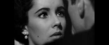 Movie still from “Zeroville” (2019), directed by James Franco – Black and white photograph of a woman looking at the camera; Extreme Close Up shot, Over the shoulder angle