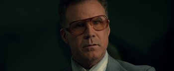 Movie still from “Zeroville” (2019), directed by James Franco – A person wearing glasses and a suit; Close Up shot, Low angle