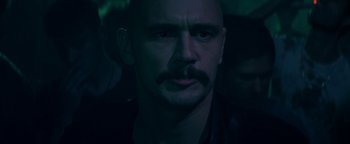 Movie still from “Zeroville” (2019), directed by James Franco – A person with a mustache; Close Up shot, Over the shoulder angle
