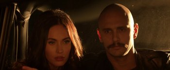 Movie still from “Zeroville” (2019), directed by James Franco – A man and a woman posing for a picture; Close Up shot, Low angle