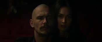 Movie still from “Zeroville” (2019), directed by James Franco – A man and a woman standing next to each other in the dark; Close Up shot, Low angle