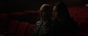 Movie still from “Zeroville” (2019), directed by James Franco – A man and a woman sitting in a movie theater; Close Up shot, High angle