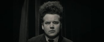 Movie still from “Zeroville” (2019), directed by James Franco – A black and white photo of a man with a curly hair; Close Up shot, Low angle
