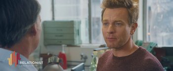 Movie still from “Zoe” (2018), directed by Drake Doremus – A person in a room; Close Up shot, Over the shoulder angle