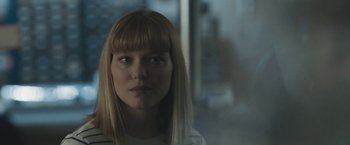 Movie still from “Zoe” (2018), directed by Drake Doremus – A person wearing a white shirt; Close Up shot, Over the shoulder angle
