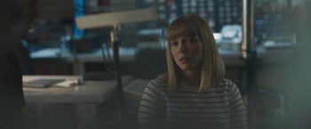 Movie still from “Zoe” (2018), directed by Drake Doremus – A woman sitting in front of a window; Medium shot, Over the shoulder angle