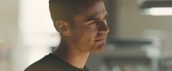 Movie still from “Zoe” (2018), directed by Drake Doremus – A man's face in the sunlight; Close Up shot, Over the shoulder angle