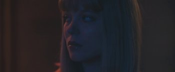 Movie still from “Zoe” (2018), directed by Drake Doremus – A person with long blonde hair; Close Up shot, Low angle