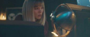 Movie still from “Zoe” (2018), directed by Drake Doremus – A woman sitting in front of a laptop computer in front of a fan; Close Up shot, Low angle