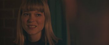 Movie still from “Zoe” (2018), directed by Drake Doremus – A woman's face in a dark room; Close Up shot, Over the shoulder angle