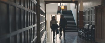 Movie still from “Zoe” (2018), directed by Drake Doremus – A man and a woman walking down a hallway; Wide shot, Low angle
