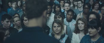 Movie still from “Zoe” (2018), directed by Drake Doremus – A group of people standing in a room; Close Up shot, High angle