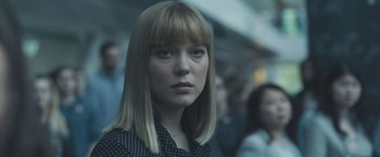 Movie still from “Zoe” (2018), directed by Drake Doremus – A person with a crowd in the background; Close Up shot, Low angle